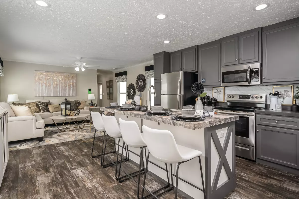 Island in the kitchen with view of the living area in the background.