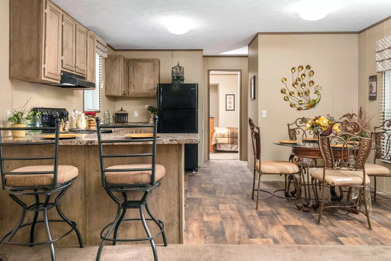 View of eat-in kitchen with breakfast bar.