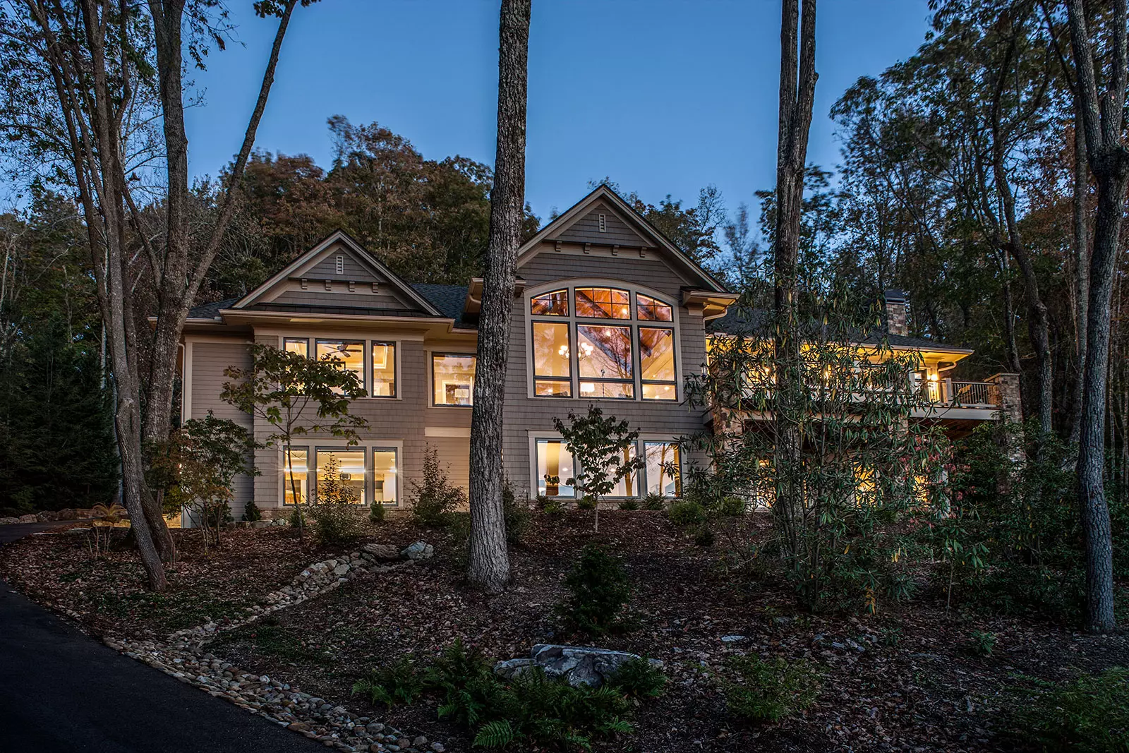 house style transitional home on a hillside