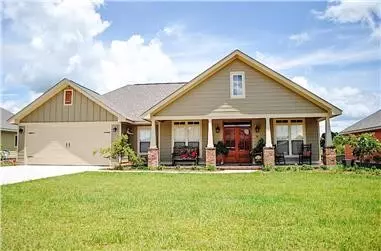 Clean lines, soft paint tones on the exterior, a pair of dormers, a covered front porch with tall columns, a pair of windows with shutters, and more attractive features on a French Country home