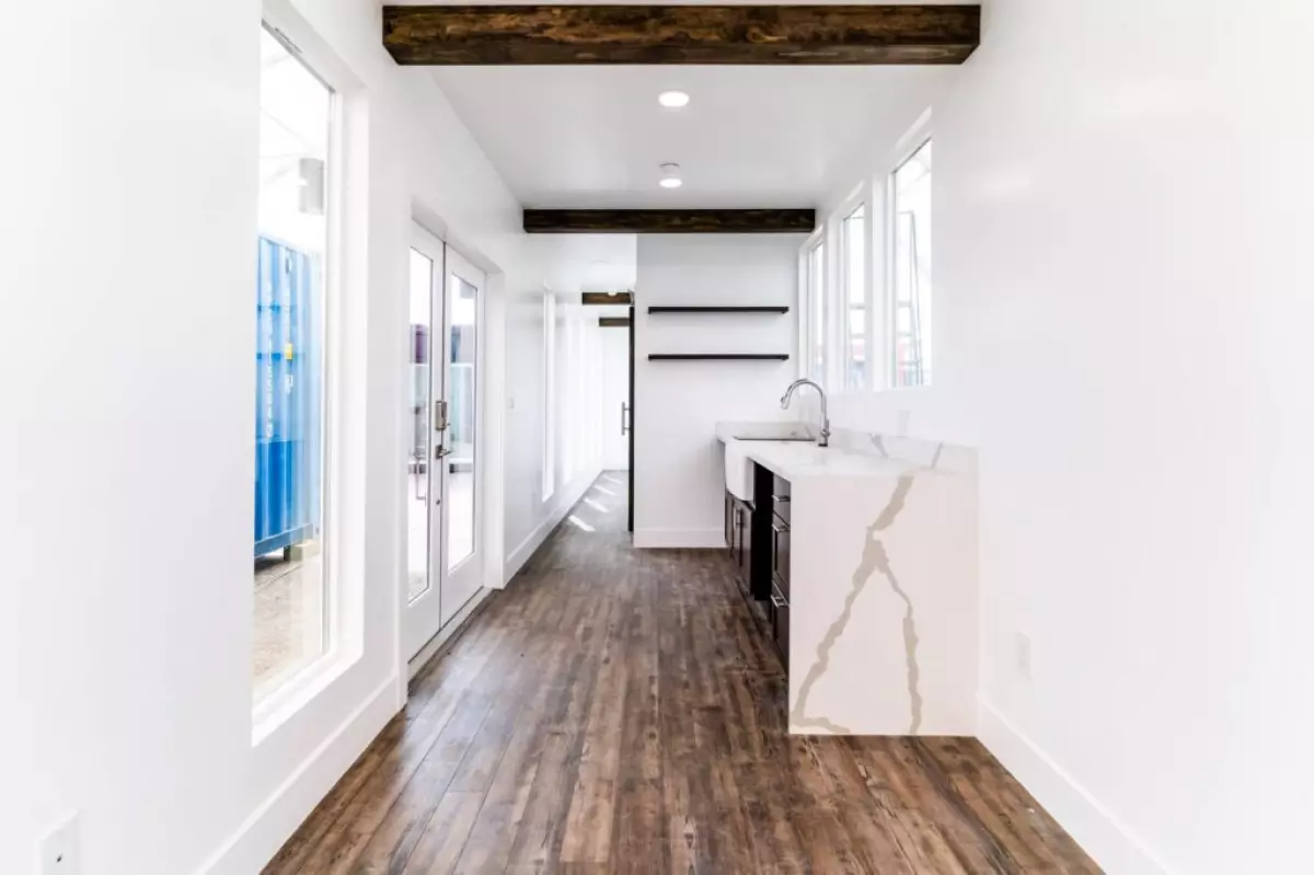 wooden walkway and basin in container home