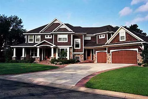 Transitional Farmhouse style home with white vertical siding and metal standing-seam roofing