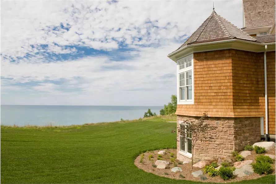 Rear view of 2-story, 4,580-sq.-ft., 5-bedroom, and 5-bath Shingle style home