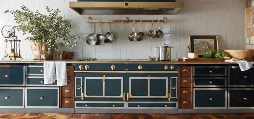 Aged copper sink and faucet with white and gray marble countertop