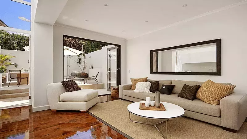 Hanging mirrors in the living room helps to promote positive energy flow within the house.