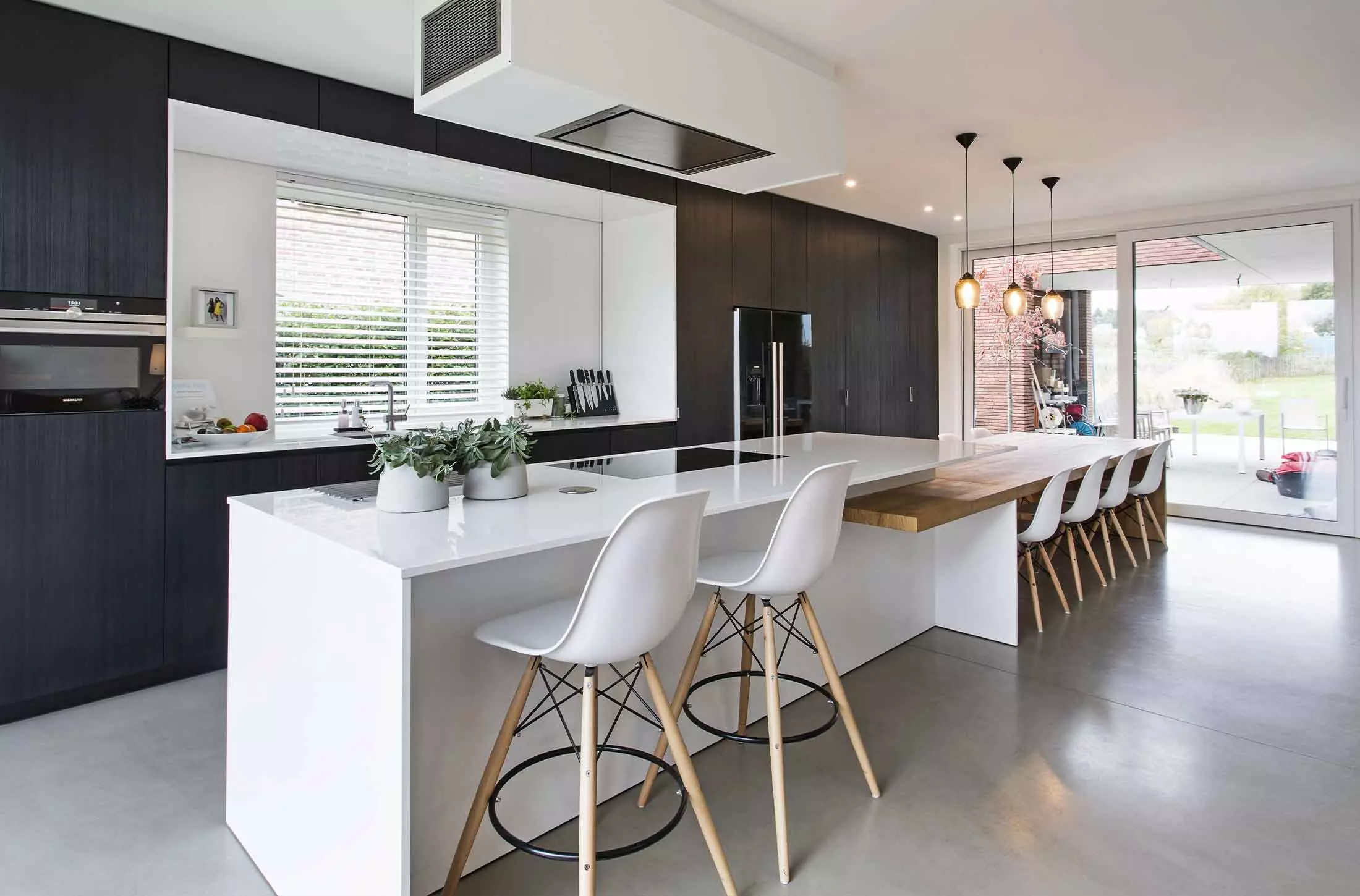 Long kitchen island with a work from home station.