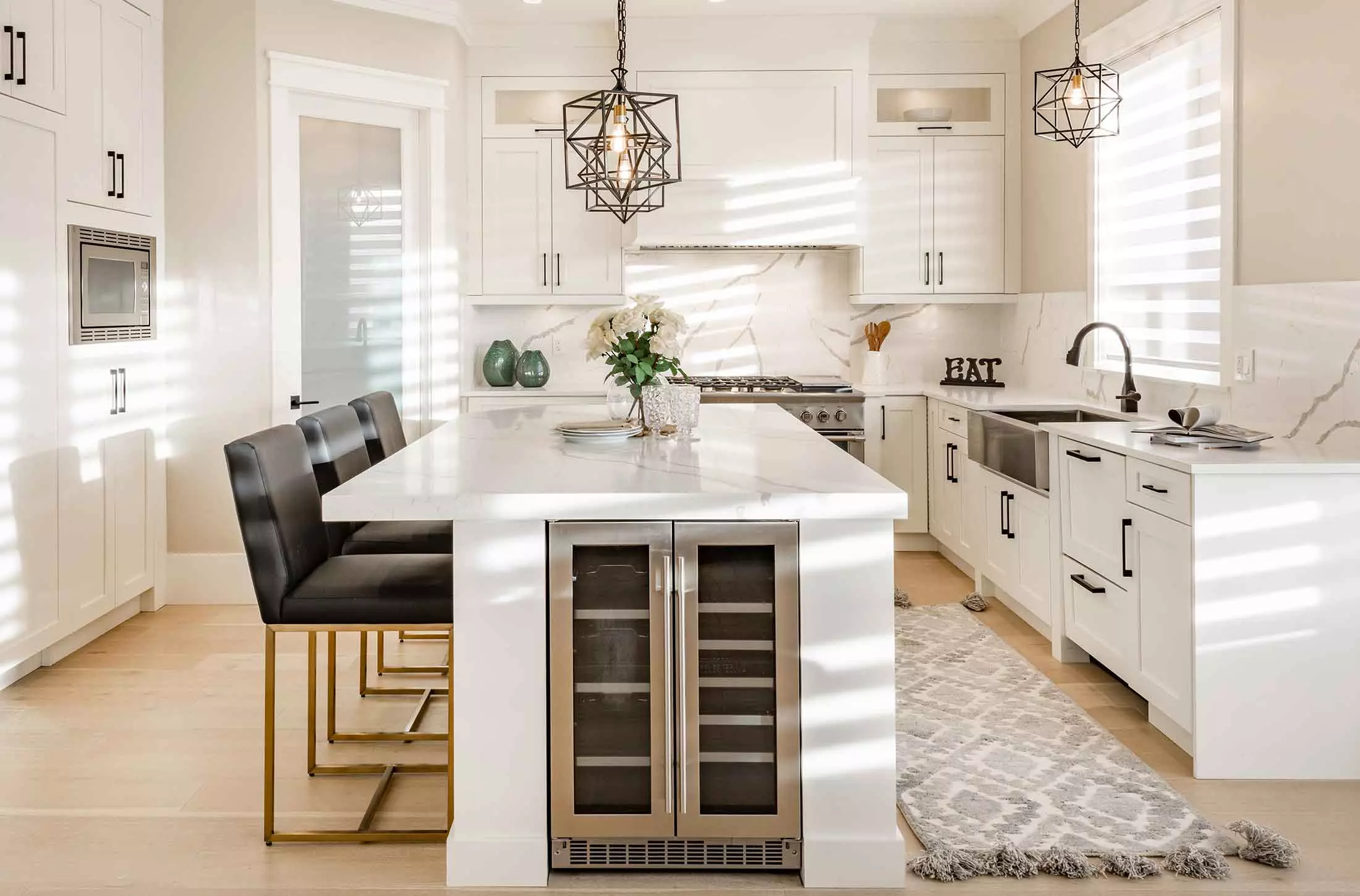 Kitchen island with wine fridge on end.