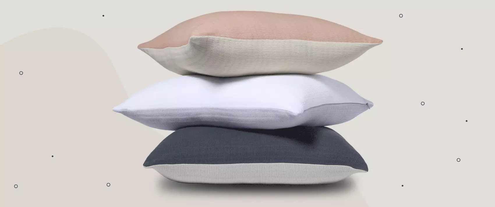 Different sized pillows stacked to show size difference