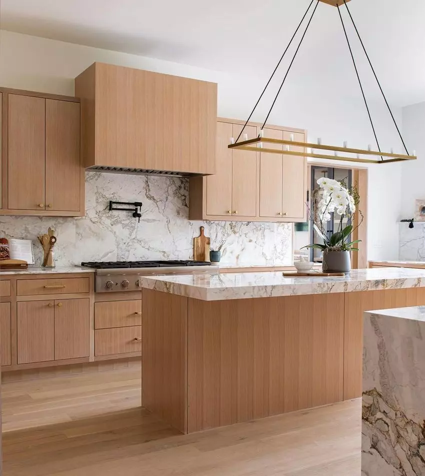 Minimalist White Kitchen Island in Mid-Century Modern Kitchen design by Anthology Interiors