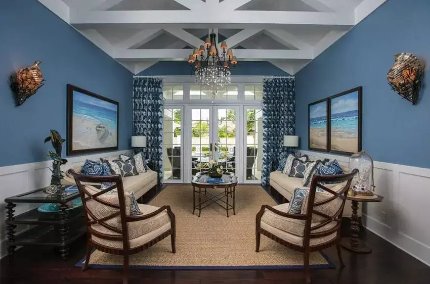 Modern living room with blue wall and picture window views of the city