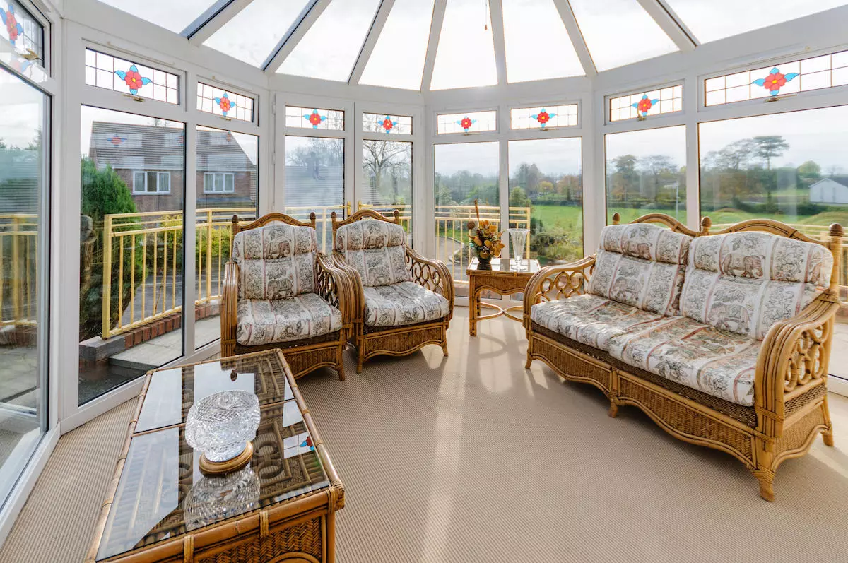 Household conservatory with cane furniture