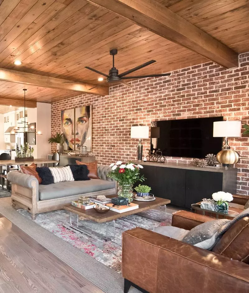 Black sofa in dark industrial living space