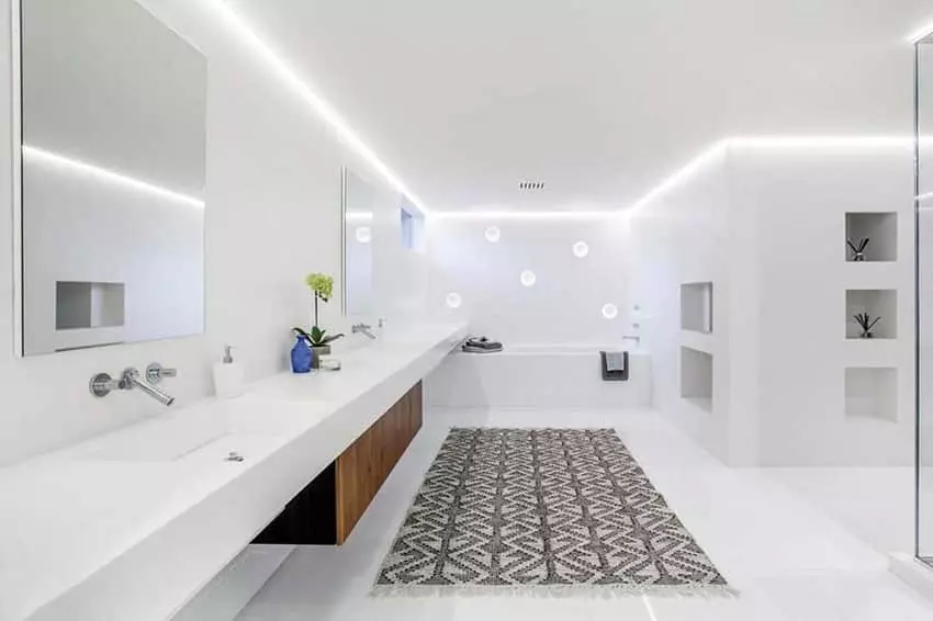 Contemporary master bathroom with silver chandelier and center tub