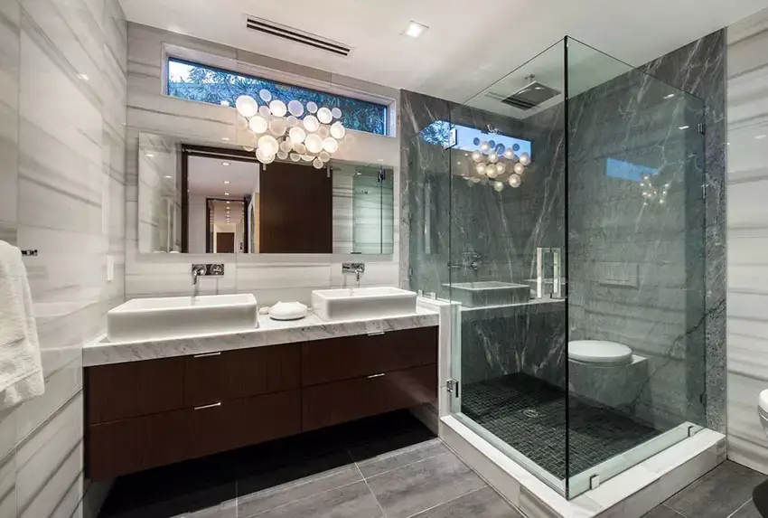 Modern master bathroom with marble tile window view from bathtub