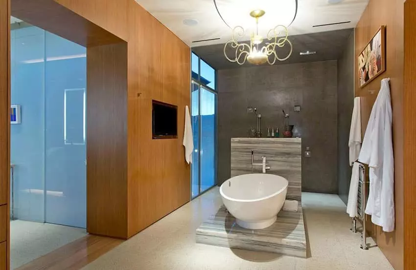 Modern bathroom with pink chandelier and mosaic tile