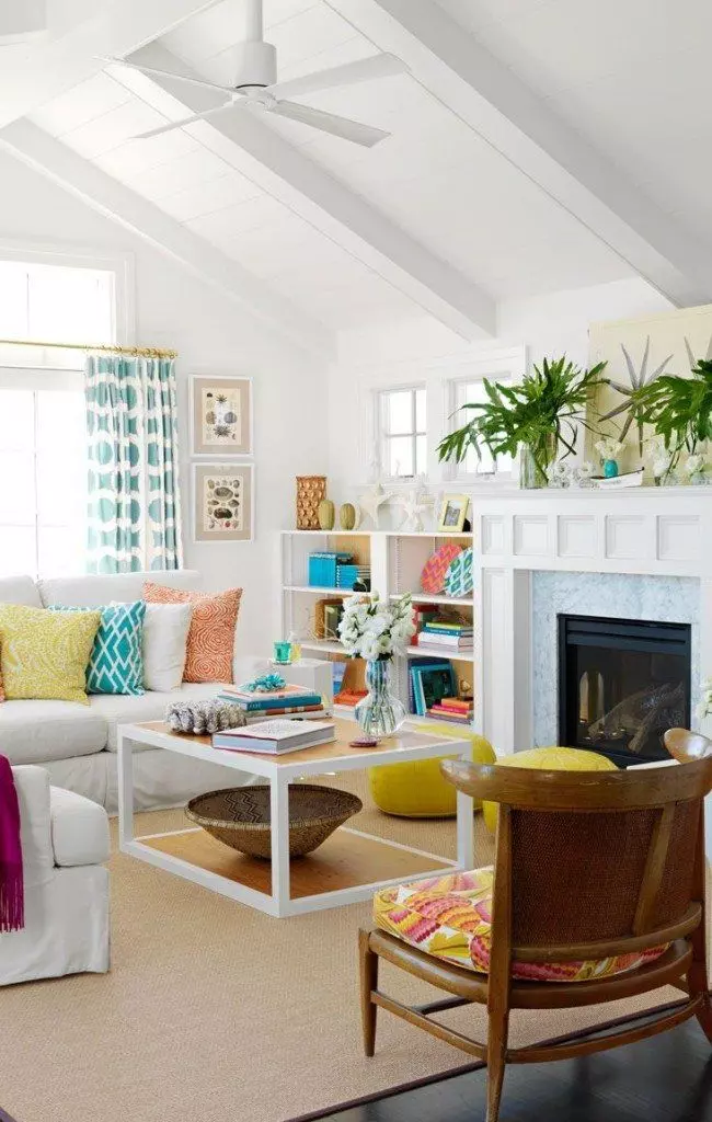 Open ceiling beams and the white trimmed fireplace