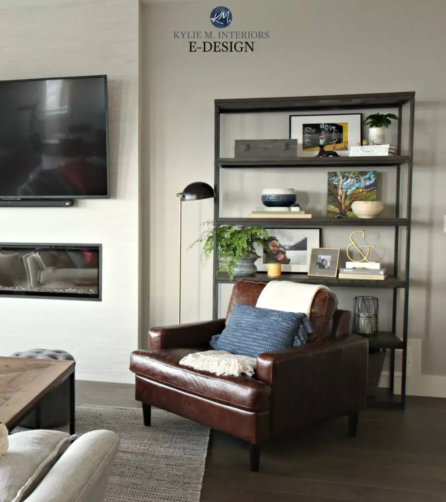 Sherwin Williams Colonnade Gray, leather accent club chair, metal and wood bookshelf with home decor