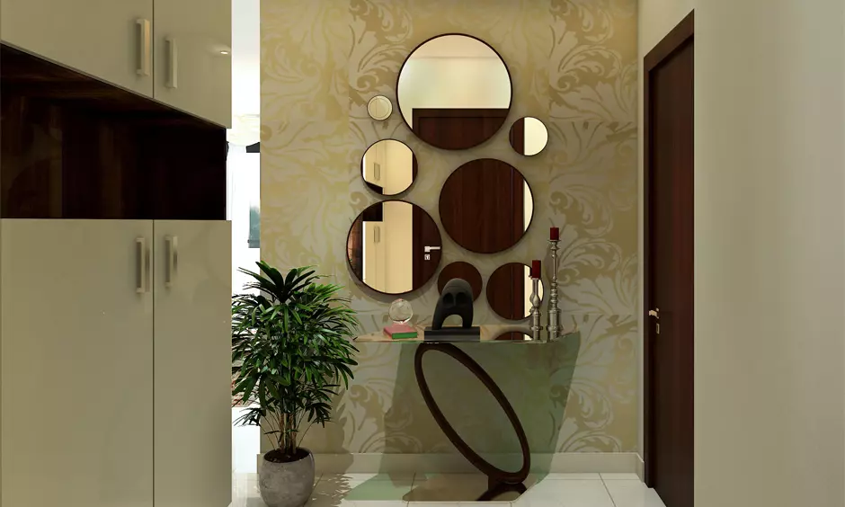 Entrance foyer interior wall design with different sizes of round mirrors has symmetry to texture wallpaper