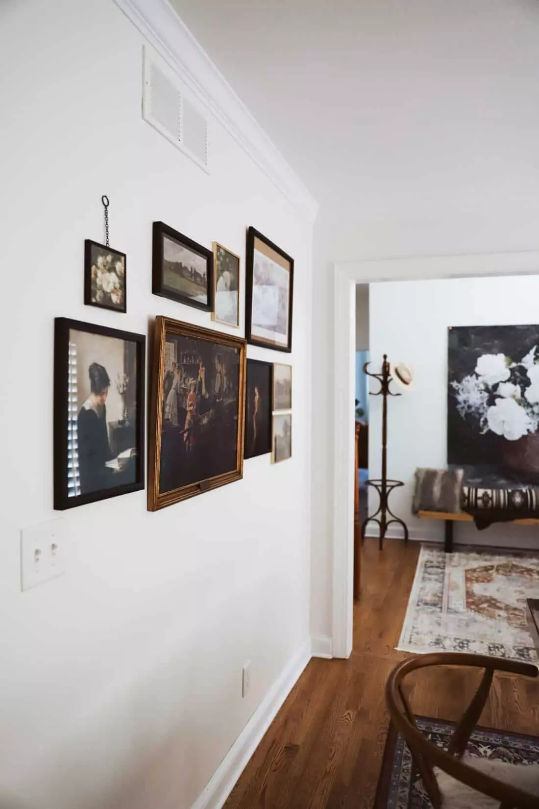 gallery wall on white dining room wall