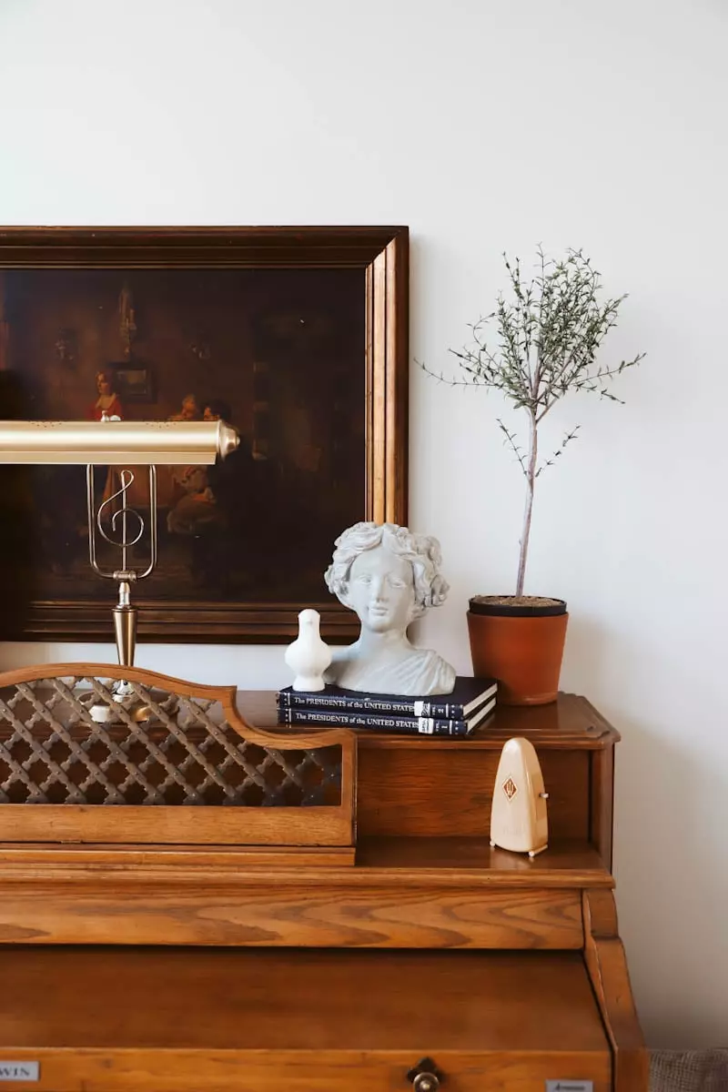 bedroom nightstand with a white swan and flowers on it