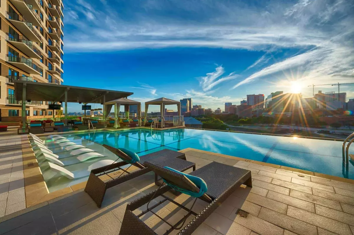 relaxing rattan chairs beside the swimming pool at residents apartments site