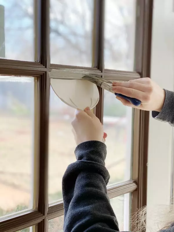 Image: Painting Window Trim Using Putty Knife