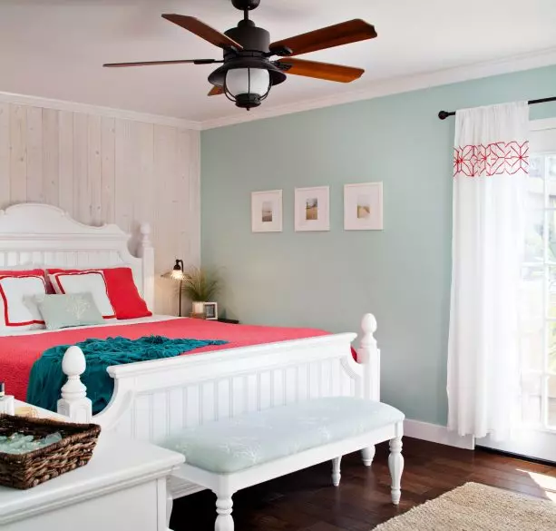 blue and grey bedroom with brown king size wooden bed