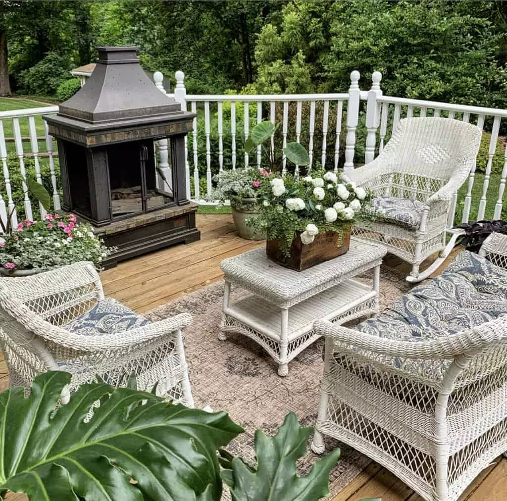 Watching the sunset from the backyard deck with 4 wicker chairs and gas fire pit