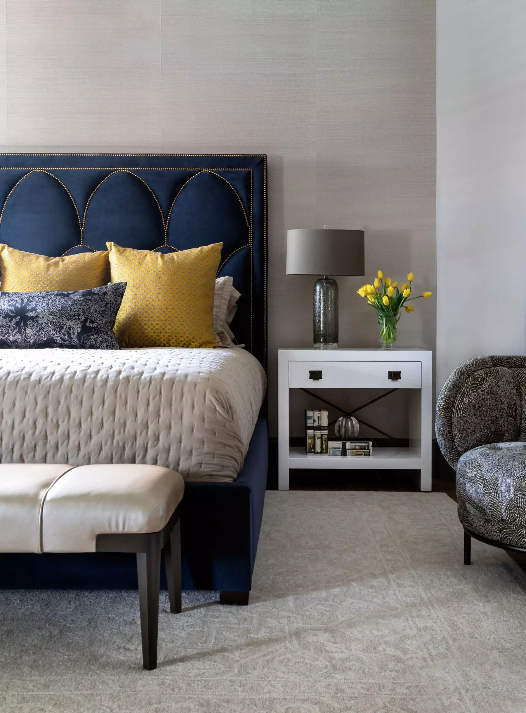 This guest bedroom designed by the Laura U Design Collective team perfectly pairs luxurious textures with beautiful jewel tones. It proves that jewel tones make the ideal accents.