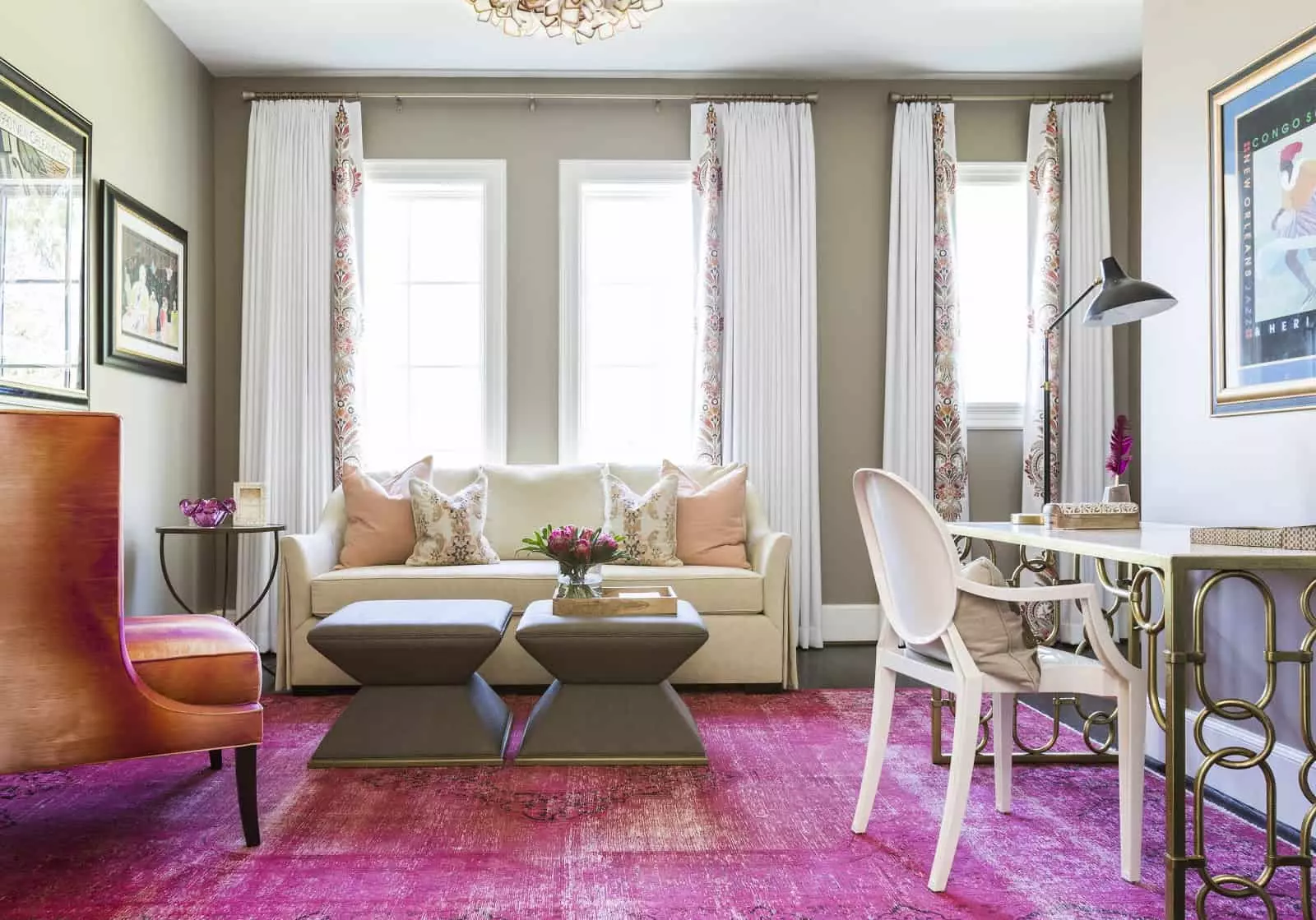 Neutral office with jewel tone accent chair and area rug