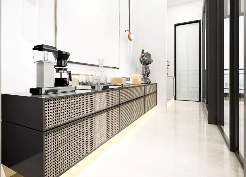 Stools, glass shelves and wine glasses on a black countertop