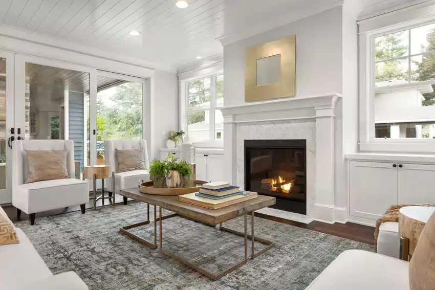 Transitional living room furniture next to contemporary kitchen