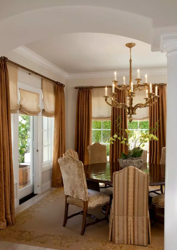 a huge bedroom featuring roman shades with beige curtains for an elegant and timeless ambiance