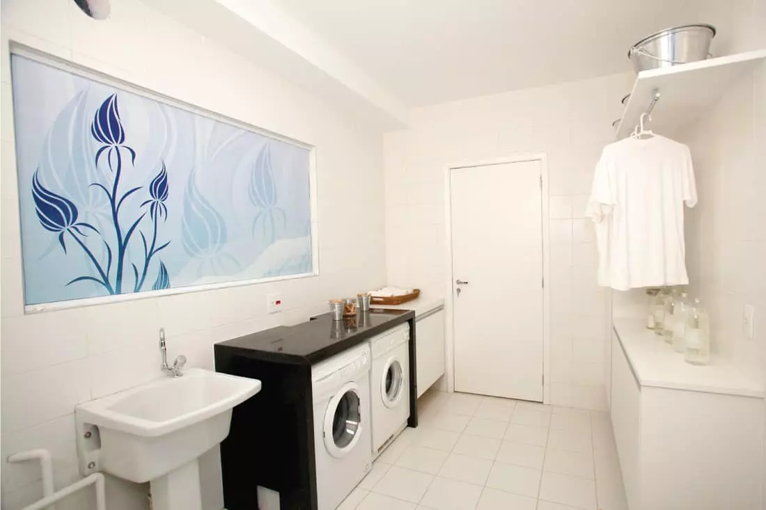 Laundry Room with Natural-Toned Tile Floor