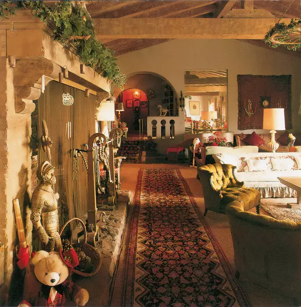 The Malibu-tile fireplace and stenciled coffered ceiling are original in a 1926 Spanish bungalow.