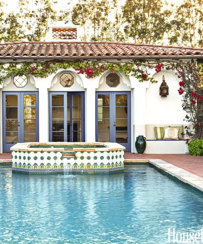 Spanish style home painted tiles by pool