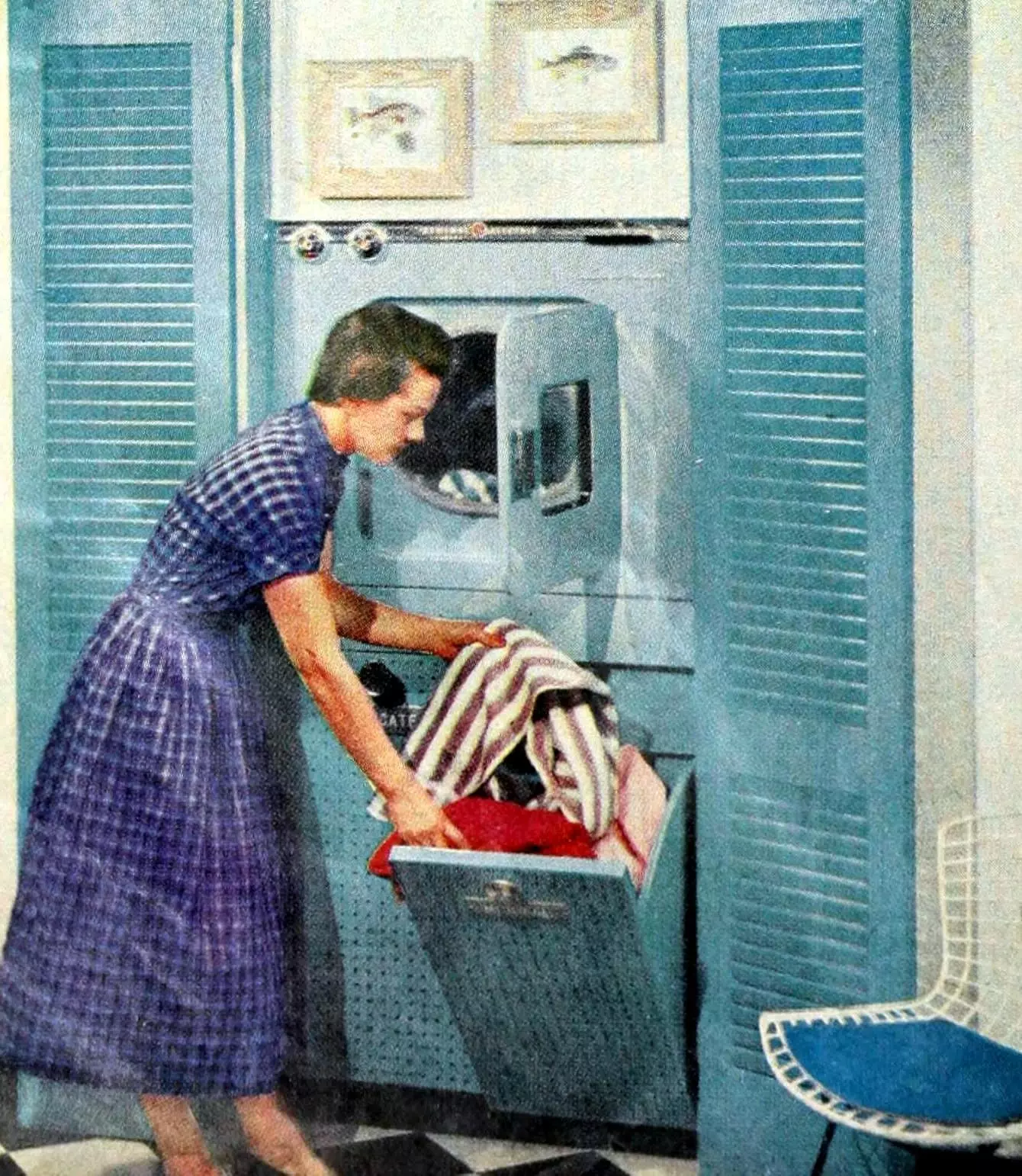 1950s laundry room with tilt-out clothing baskets (1956)