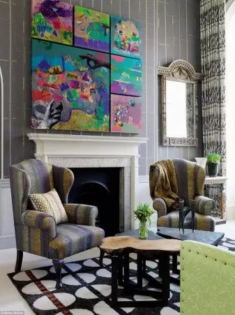 A living room with colorful furniture and a fireplace that is quirky and funky.