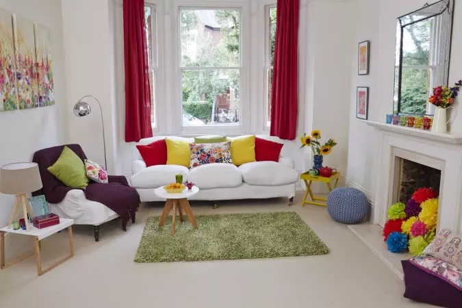 A funky living room with a fireplace.