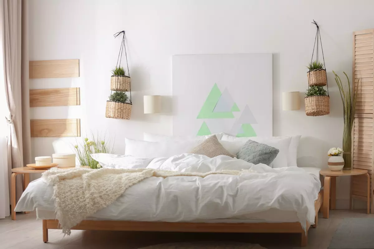 Couple hanging a piece of art in their home