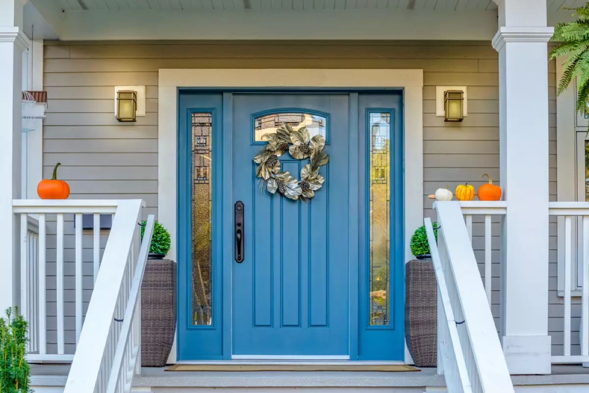 blue front entry door with wreath