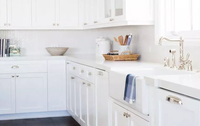 white cabinets with black hinges and handles