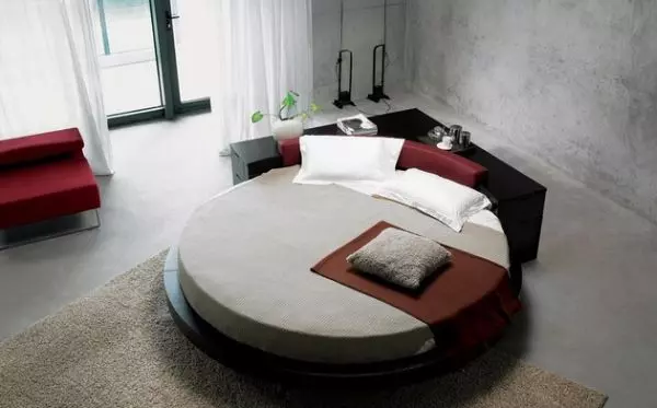 Circle bed with a king-size rectangular mattress sitting nicely on a wooden floor