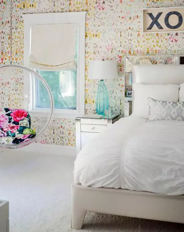 Teen girls bedroom with bubble hanging chair with silver cushions and heart-shaped bed