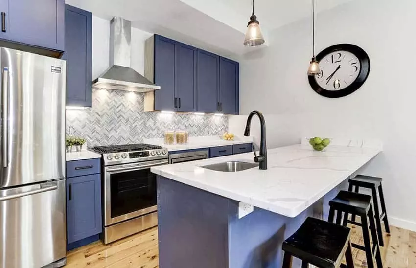 Kitchen with walnut floors, chrome faucet, and bar lighting