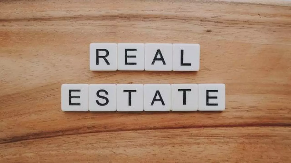 scrabble tiles that spell real estate representing real estate newsletter content