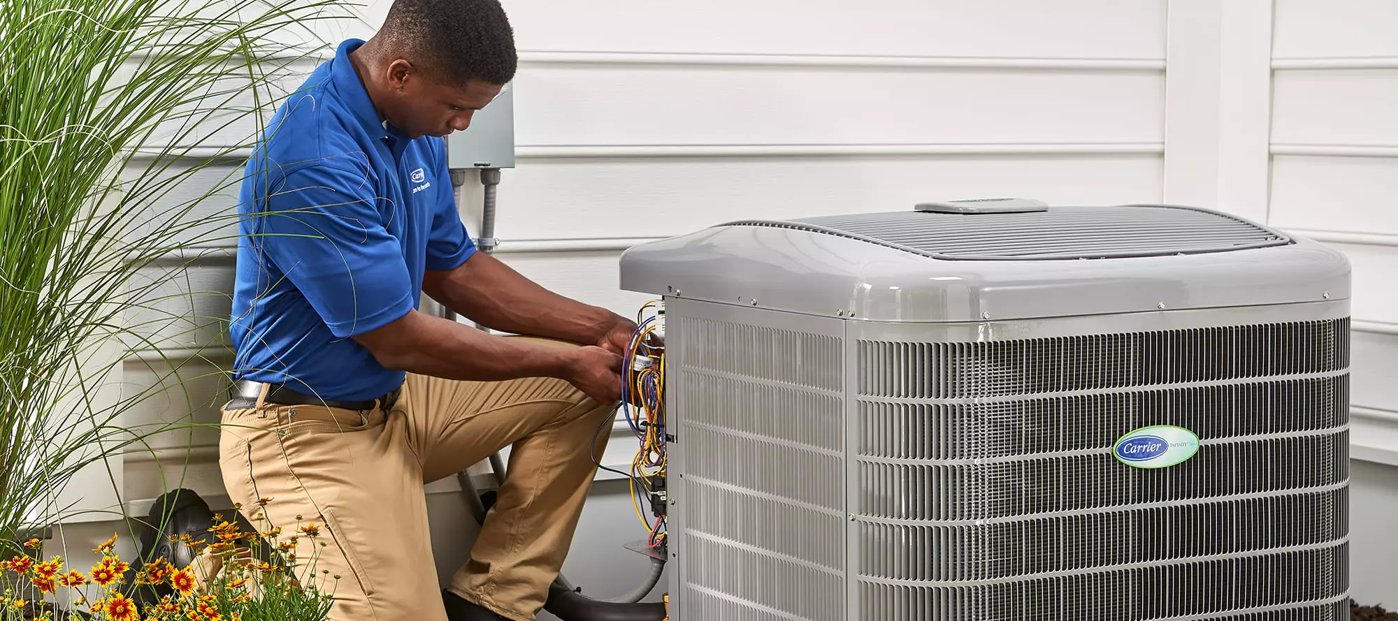 HVAC repairs being performed by a carrier professional