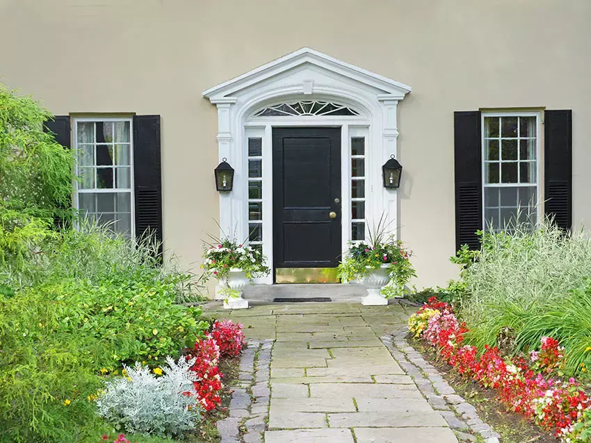 Home with stucco exterior and flagstone walkway