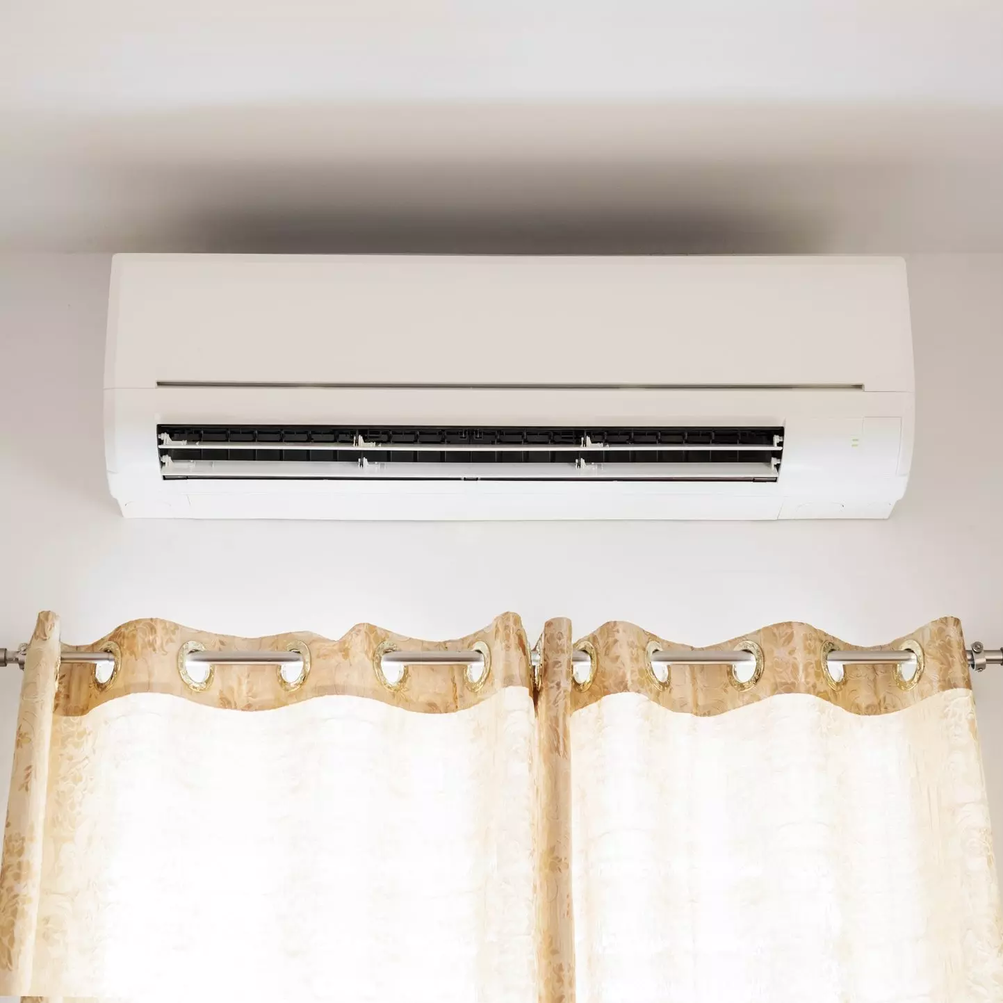 Wall mounted Air conditioning above window in a house