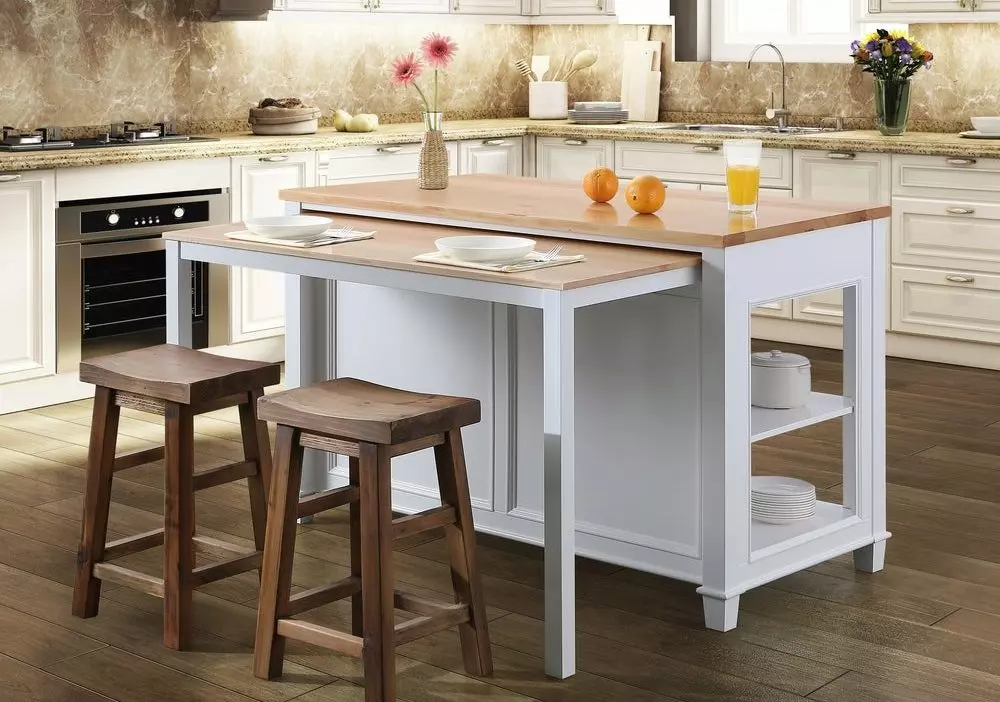 Freestanding kitchen island with a hidden slide-out table for two persons